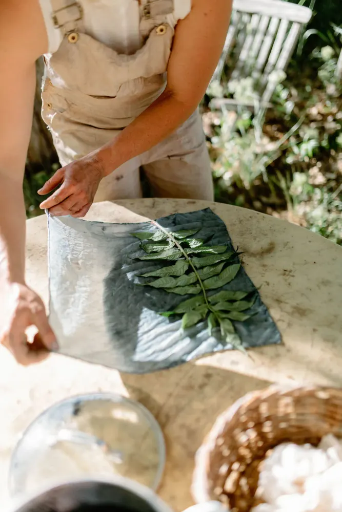 Laying botanicals onto cloth for printing